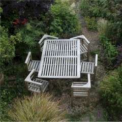 Six seater teak garden set in the manner of Heals